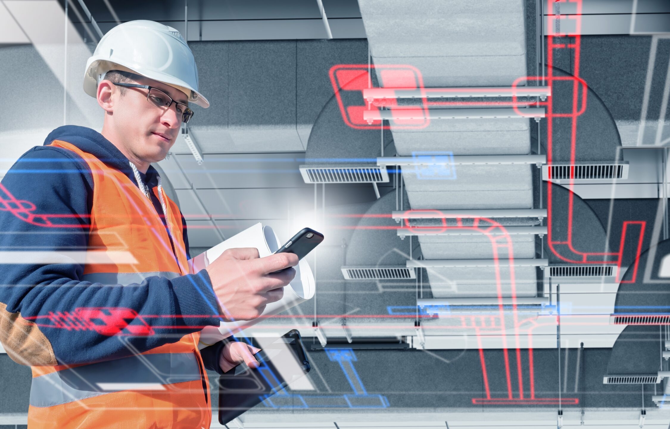 Engineer,In,Helmet,And,Safety,Vest,Uses,Smartphone,And,Tablet BAScloud Anwender nutzt virtuelle GLT in der App